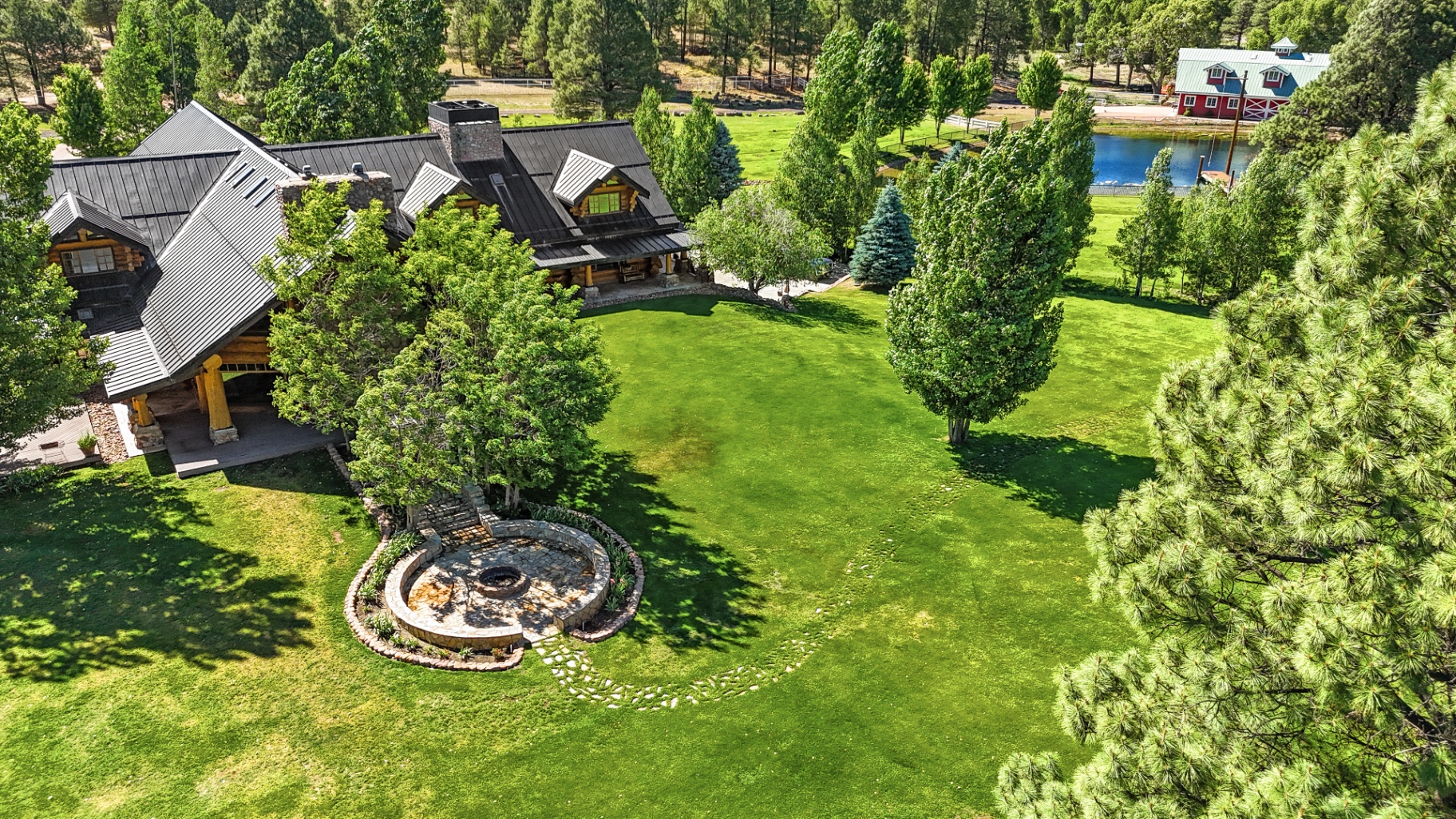 Legacy Ranch at golden hour, ponderosa pines and a wood lodge